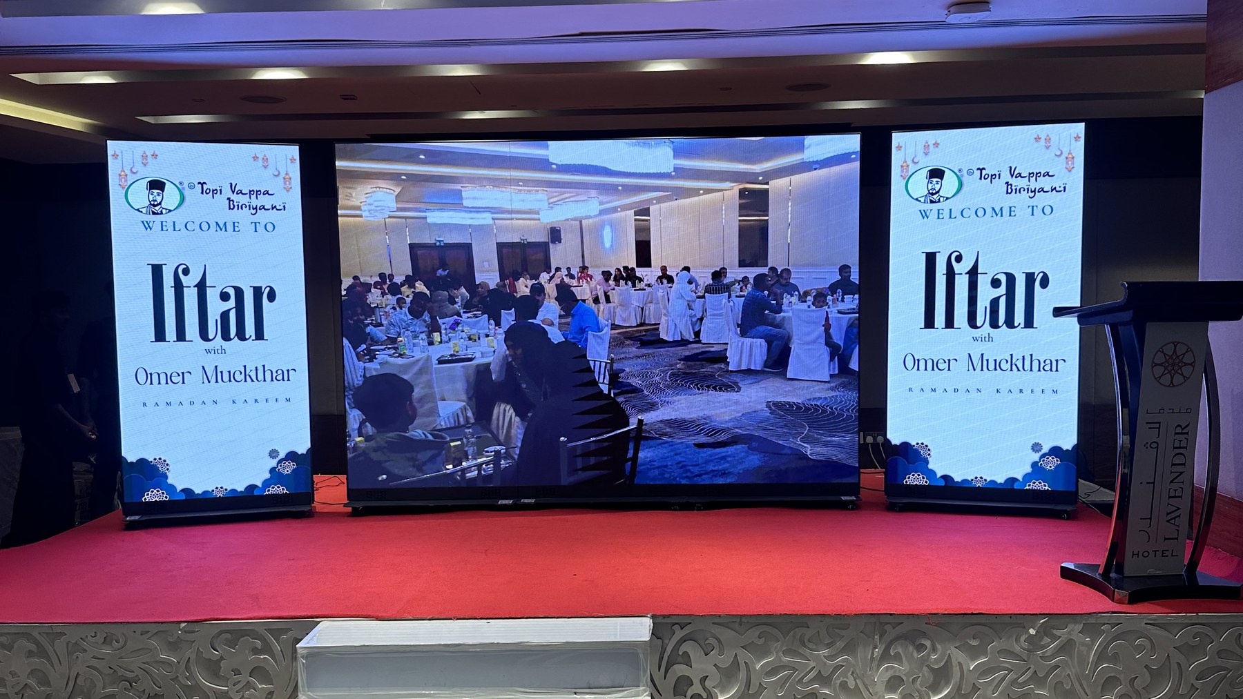 Pixanova LED roll-up screens either side of a linked LED wall on stage at the Iftar event, Lavender Hotel Dubai