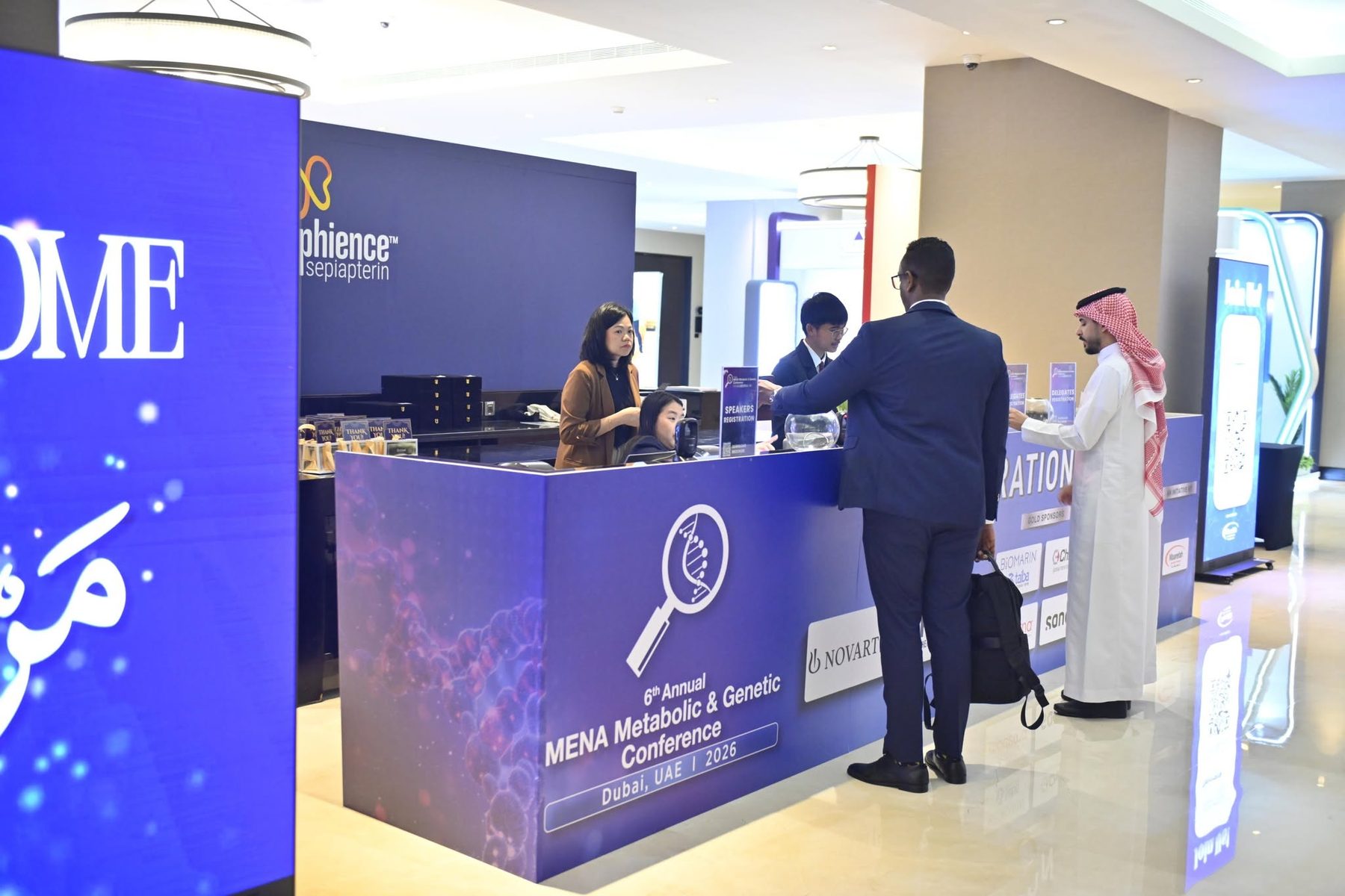 Pixanova portable LED roll-up screens beside the registration desk at the MENA Metabolic & Genetic Conference 2026